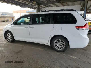 2012 Toyota Sienna XLE AAS with VIN 5TDYK3DC7CS275496, listed as a Copart auction lot 62612815 with 130,027 mi miles and Salvage title. Bid and sale history available at DreamBid. Image 2.