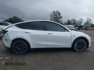 2023 Tesla Model Y Long Range with VIN 7SAYGDEE1PA106057, listed as a IAAI auction lot 41778642 with 1 mi miles. Bid and sale history available at carsss.com. Image 14.