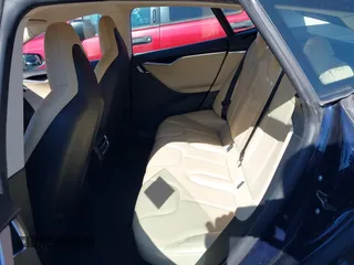 2013 Tesla Model S with VIN 5YJSA1CG2DFP14689, listed as a IAAI auction lot 41648508 with 98,578 mi miles and . Bid and sale history available at carsss.com. Image 8.
