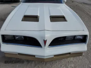 1978 Pontiac Firebird z VIN 2U87K8L123850, wystawiony jako Copart lot #79076374 z przebiegiem 64 829 mil mil oraz Szkody całkowita. Historia ofert i sprzedaży dostępna na DreamBid. Obrazek 11.