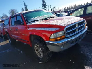 2002 Dodge Dakota SLT with VIN 1B7HG48N62S518157, listed as a IAAI auction lot 41471025 with 291,644 mi miles. Bid and sale history available at carsss.com. Image 1.