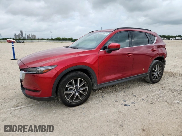 2018 Mazda CX-5 Grand Touring with VIN JM3KFADM8J0451535, listed as a Copart auction lot 59990435 with 77,163 mi miles and Salvage title. Bid and sale history available at DreamBid. Image 1.