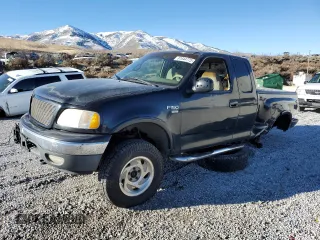 2001 Ford F-150 XL z VIN 1FTRX08LX1KF22433, wystawiony jako Copart lot #87644775 z przebiegiem 306 818 mil mil oraz Szkoda całkowita • Salvage title. Historia ofert i sprzedaży dostępna na DreamBid. Obrazek 1.