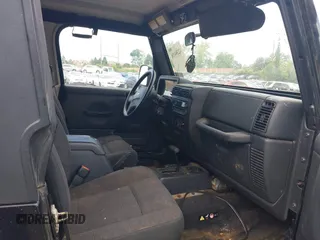 2004 Jeep Wrangler Sport z VIN 1J4FA49S94P792689, wystawiony jako IAAI lot #42394196 z przebiegiem Nie podano mil oraz . Historia ofert i sprzedaży dostępna na DreamBid. Obrazek 5.