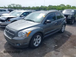 2011 Dodge Caliber Mainstreet with VIN 1B3CB3HA1BD247594, listed as a IAAI auction lot 42082305 with 122,438 mi miles. Bid and sale history available at carsss.com. Image 2.