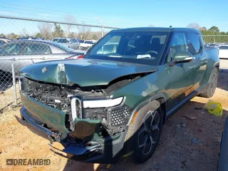 2022 Rivian R1T Adventure Package with VIN 7FCTGAAA2NN006098, listed as a IAAI auction lot 41172815 with 1 mi miles. Bid and sale history available at carsss.com. Image 2.