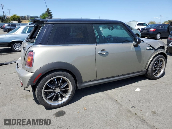 2009 MINI Hardtop S with VIN WMWMF73549TT94143, listed as a Copart auction lot 52120615 with 144,334 mi miles and Salvage Title. Bid and sale history available at DreamBid. Image 3.