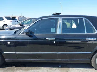 2001 Bentley Arnage with VIN SCBLC31E11CX06297, listed as a IAAI auction lot 41980275 with 63,510 mi miles and . Bid and sale history available at DreamBid. Image 14.