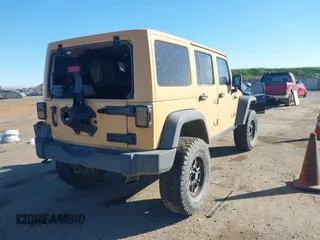 2013 Jeep Wrangler Unlimited Rubicon with VIN 1C4BJWFG3DL632668, listed as a IAAI auction lot 41751546 with 153,149 mi miles. Bid and sale history available at carsss.com. Image 4.