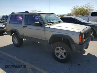 2000 Jeep Cherokee SE with VIN 1J4FF27SXYL140055, listed as a Copart auction lot 70315454 with 176,017 mi miles and Salvage title. Bid and sale history available at DreamBid. Image 4.