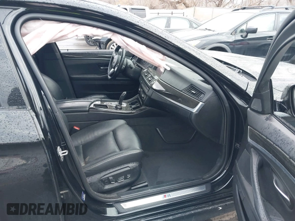 2015 BMW 5 Series 535i with VIN WBA5B1C51FG125924, listed as a IAAI auction lot 41060431 with 102,957 mi miles and . Bid and sale history available at carsss.com. Image 5.