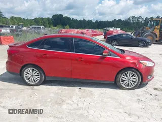 2018 Ford Focus Titanium z VIN 1FADP3J23JL295888, wystawiony jako IAAI lot #42524088 z przebiegiem 108 812 mil mil oraz . Historia ofert i sprzedaży dostępna na DreamBid. Obrazek 13.