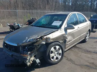 2004 Kia Spectra LX with VIN KNAFE121745039519, listed as a IAAI auction lot 41482402 with 201,123 mi miles. Bid and sale history available at carsss.com. Image 6.