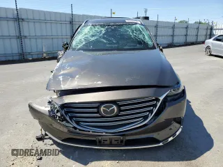 2018 Mazda CX-9 Grand Touring with VIN JM3TCADY5J0200052, listed as a Copart auction lot 55160715 with 68,464 mi miles and Salvage title. Bid and sale history available at DreamBid. Image 5.