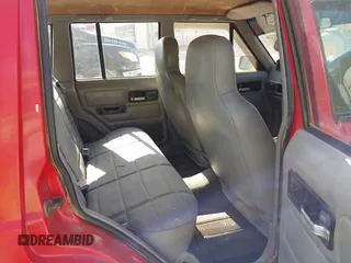 1996 Jeep Cherokee z VIN 1J4FB28S4TL145447, wystawiony jako IAAI lot #42414080 z przebiegiem 437 448 mil mil oraz . Historia ofert i sprzedaży dostępna na DreamBid. Obrazek 8.