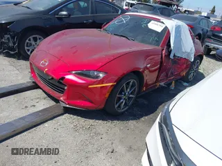 2021 Mazda MX-5 Miata Grand Touring с VIN JM1NDAM71M0459437, выставлен на аукционе IAAI как лот 41808704 с пробегом 19 368 миль миль и . История ставок и продаж доступна на DreamBid. Изображение 23.