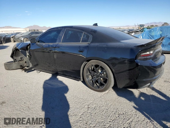 2015 Dodge Charger SXT with VIN 2C3CDXHG8FH769883, listed as a Copart auction lot 87723825 with 81,859 mi miles and Salvage Title. Bid and sale history available at DreamBid. Image 2.