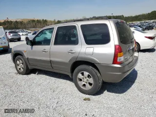 2001 Mazda Tribute LX with VIN 4F2YU091X1KM39019, listed as a Copart auction lot 50946945 with 255,148 mi miles and Salvage Title. Bid and sale history available at carsss.com. Image 2.