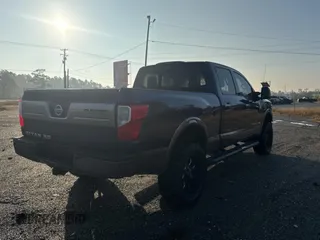 2016 Nissan Titan XD Platinum Reserve with VIN 1N6BA1F25GN500038, listed as a Copart auction lot 84605344 with 205,859 mi miles and Salvage Title. Bid and sale history available at carsss.com. Image 4.