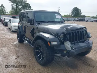 2021 Jeep Wrangler Unlimited Sport S with VIN 1C4HJXDG2MW700461, listed as a IAAI auction lot 41894307 with 82,454 mi miles. Bid and sale history available at carsss.com. Image 1.