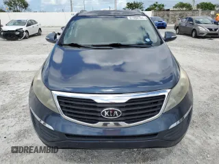 2012 Kia Sportage LX z VIN KNDPB3A29C7240993, wystawiony jako Copart lot #61408165 z przebiegiem 171 453 mil mil oraz Czysty tytuł • Clean title. Historia ofert i sprzedaży dostępna na DreamBid. Obrazek 5.