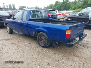 1992 Toyota Pickup DLX z VIN JT4RN93P5N5062042, wystawiony jako IAAI lot #42522750 z przebiegiem 279 395 mil mil oraz . Historia ofert i sprzedaży dostępna na DreamBid. Obrazek 3.