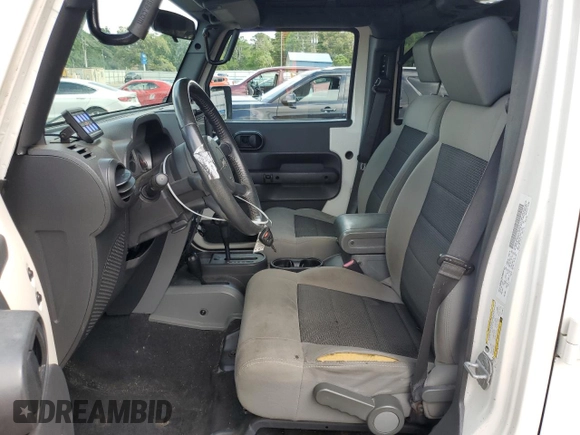 2010 Jeep Wrangler Unlimited Rubicon with VIN 1J4BA6H10AL176014, listed as a Copart auction lot 57092255 with 138,253 mi miles and Salvage title. Bid and sale history available at DreamBid. Image 7.