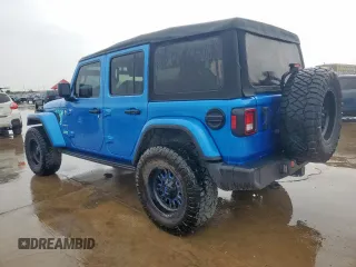 2023 Jeep Wrangler Sahara with VIN 1C4HJXEG7PW590252, listed as a Copart auction lot 59377765 with 32,689 mi miles and Salvage title. Bid and sale history available at DreamBid. Image 2.
