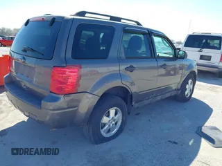 2011 Ford Escape XLT with VIN 1FMCU0D74BKA81385, listed as a IAAI auction lot 41895835 with 238,298 mi miles. Bid and sale history available at carsss.com. Image 4.