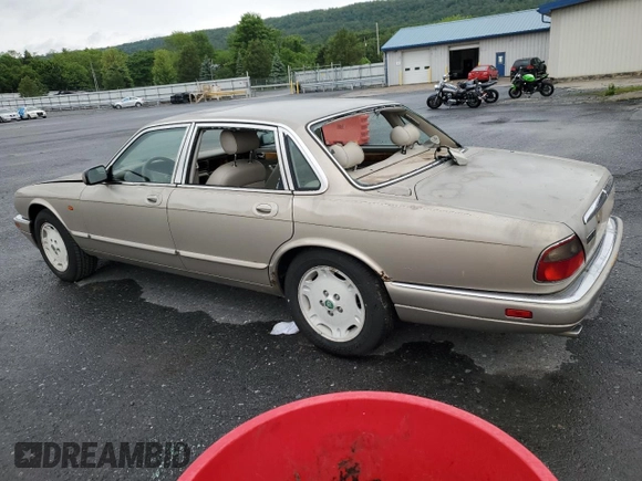 1995 Jaguar XJ with VIN SAJHX174XSC738856, listed as a Copart auction lot 57768915 with Not provided miles and Salvage title. Bid and sale history available at DreamBid. Image 2.