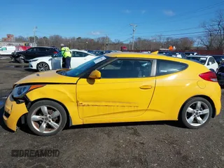 2012 Hyundai Veloster w/Black Int with VIN KMHTC6ADXCU042788, listed as a IAAI auction lot 41854662 with 90,500 mi miles. Bid and sale history available at carsss.com. Image 19.