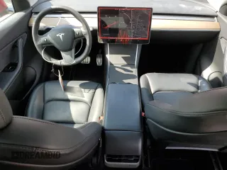 2021 Tesla Model Y Standard Range with VIN 5YJYGDED3MF107259, listed as a Copart auction lot 48566935 with 68,561 mi miles and Salvage Title. Bid and sale history available at carsss.com. Image 8.