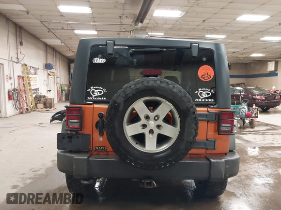 2011 Jeep Wrangler Rubicon with VIN 1J4BA6D15BL624268, listed as a IAAI auction lot 41430121 with 142,433 mi miles and . Bid and sale history available at carsss.com. Image 17.