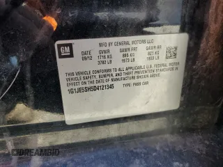 2013 Chevrolet Sonic LTZ z VIN 1G1JE5SH5D4121345, wystawiony jako Copart lot #83672124 z przebiegiem 109 428 mil mil oraz Szkoda całkowita • Salvage title. Historia ofert i sprzedaży dostępna na DreamBid. Obrazek 12.