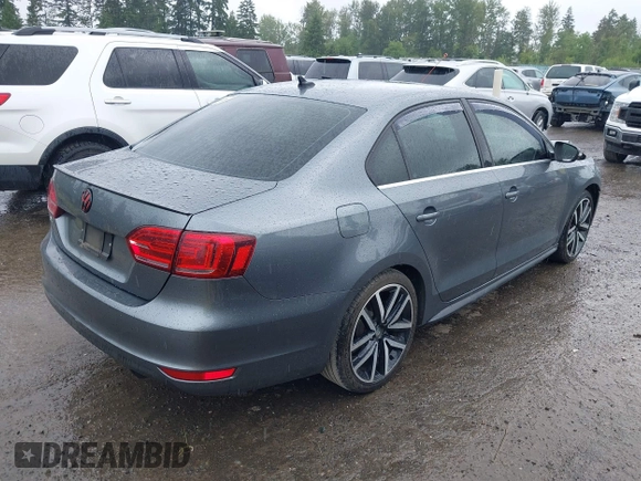 2014 Volkswagen Jetta GLI z VIN 3VW4T7AJ2EM208598, wystawiony jako IAAI lot #42381855 z przebiegiem 82 761 mil mil oraz . Historia ofert i sprzedaży dostępna na DreamBid. Obrazek 4.