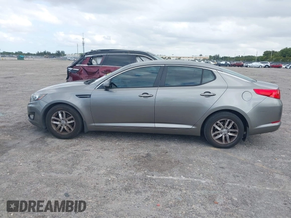 2013 Kia Optima LX z VIN 5XXGM4A74DG147688, wystawiony jako IAAI lot #42127503 z przebiegiem 148 705 mil mil oraz . Historia ofert i sprzedaży dostępna na DreamBid. Obrazek 14.