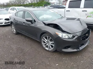 2016 Mazda Mazda6 i Touring with VIN JM1GJ1V50G1463315, listed as a IAAI auction lot 41889935 with 129,254 mi miles. Bid and sale history available at carsss.com. Image 1.