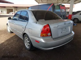 2003 Hyundai Accent GL with VIN KMHCG45C93U476176, listed as a IAAI auction lot 41940608 with 212,264 mi miles. Bid and sale history available at carsss.com. Image 3.