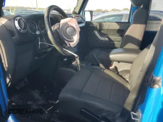 2011 Jeep Wrangler Sahara with VIN 1J4GA5D15BL632709, listed as a Copart auction lot 84118104 with 87,644 mi miles and Salvage Title. Bid and sale history available at DreamBid. Image 7.