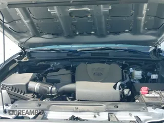 2022 Toyota Tacoma SR z VIN 3TYCZ5AN3NT091901, wystawiony jako IAAI lot #43203869 z przebiegiem 29 572 mil mil oraz . Historia ofert i sprzedaży dostępna na DreamBid. Obrazek 21.