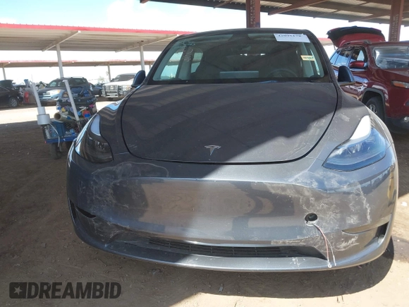 2023 Tesla Model Y Long Range with VIN 7SAYGDEE4PF875915, listed as a IAAI auction lot 42095178 with 11,928 mi miles and . Bid and sale history available at DreamBid. Image 12.