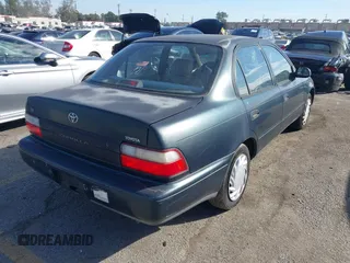 1997 Toyota Corolla with VIN 1NXBA02E5VZ595972, listed as a IAAI auction lot 41622050 with 143,577 mi miles and . Bid and sale history available at DreamBid. Image 4.