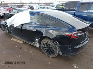 2023 Tesla Model 3 z VIN 5YJ3E1EA1PF512562, wystawiony jako IAAI lot #41719618 z przebiegiem 43 612 mil mil oraz . Historia ofert i sprzedaży dostępna na DreamBid. Obrazek 3.