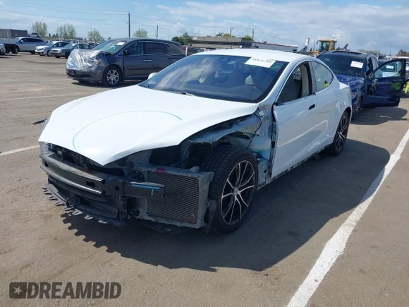 2014 Tesla Model S 60 with VIN 5YJSA1H10EFP56526, listed as a IAAI auction lot 41871784 with 143,361 mi miles and . Bid and sale history available at DreamBid. Image 6.
