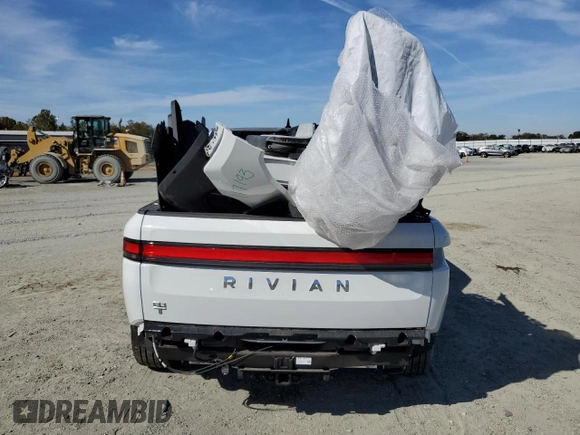 2024 Rivian R1T Adventure z VIN 7FCTGCAA9RN030318, wystawiony jako Copart lot #77036474 z przebiegiem 3 522 mil mil oraz Szkoda całkowita • Salvage title. Historia ofert i sprzedaży dostępna na DreamBid. Obrazek 6.