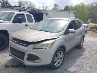 2015 Ford Escape Titanium with VIN 1FMCU0J98FUA87044, listed as a IAAI auction lot 41952096 with 257,437 mi miles. Bid and sale history available at carsss.com. Image 2.