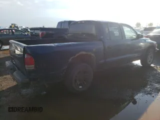 2001 Dodge Dakota Sport z VIN 1B7HL2AN51S225570, wystawiony jako Copart lot #66186174 z przebiegiem 295 142 mil mil oraz Szkoda całkowita • Salvage title. Historia ofert i sprzedaży dostępna na DreamBid. Obrazek 3.
