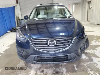 2016 Mazda CX-5 Grand Touring with VIN JM3KE4DY9G0708024, listed as a Copart auction lot 44689995 with 113,002 mi miles and Salvage Title. Bid and sale history available at DreamBid. Image 5.
