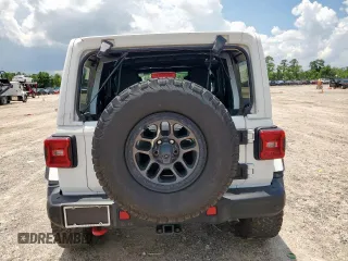 2021 Jeep Wrangler Unlimited Rubicon with VIN 1C4JJXFG1MW849460, listed as a Copart auction lot 62701895 with 54,517 mi miles and Salvage title. Bid and sale history available at DreamBid. Image 6.