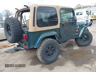 1999 Jeep Wrangler Sahara with VIN 1J4FY49S7XP440582, listed as a IAAI auction lot 41967151 with 163,710 mi miles and . Bid and sale history available at carsss.com. Image 4.